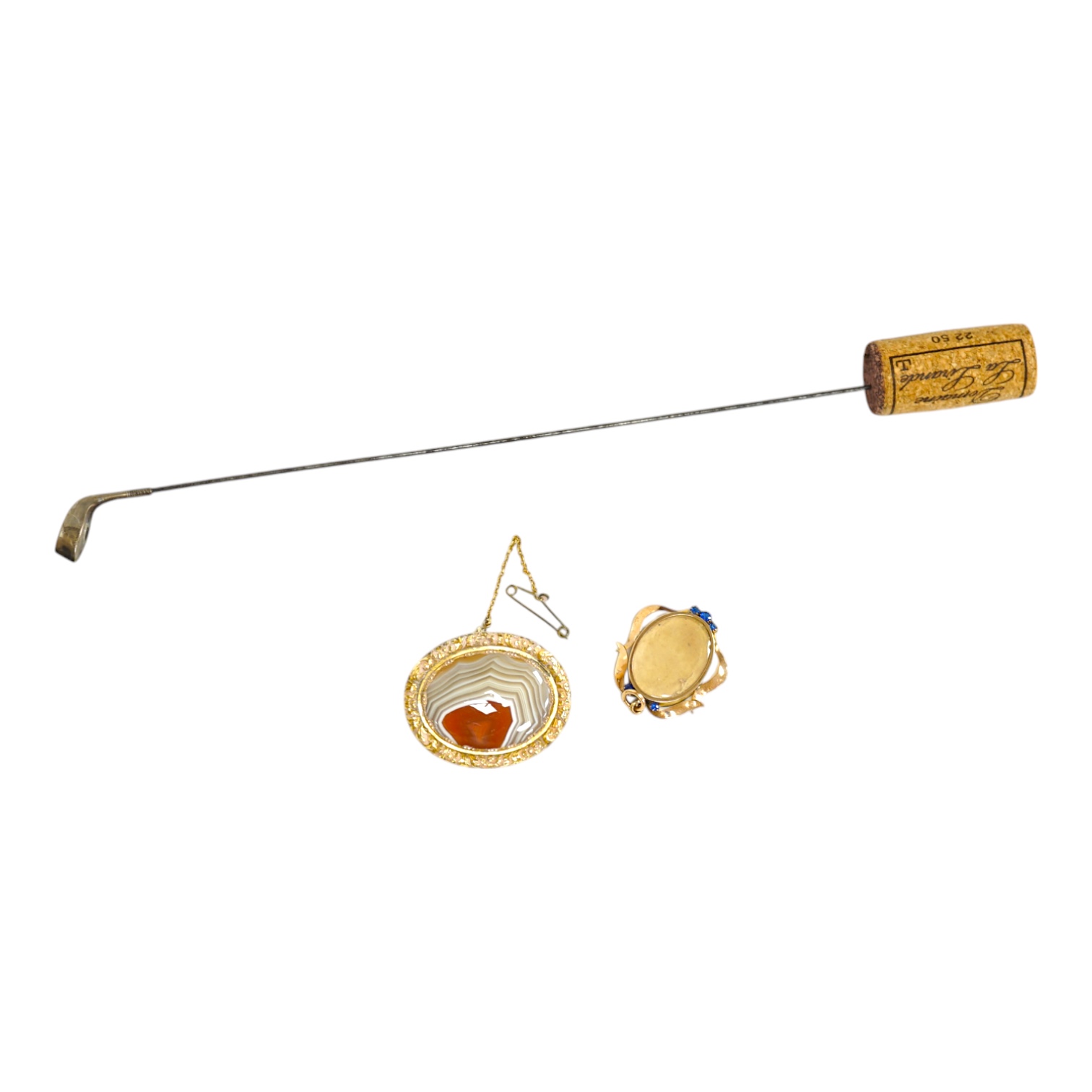 An early 20th century 9ct and gem set oval locket (lacking back?), 32mm, together with a silver mounted golf club hat pin and a mounted agate brooch. Condition - poor to fair